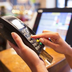 Woman,Hand,With,Credit,Card,Swipe,Through,Terminal,For,Sale